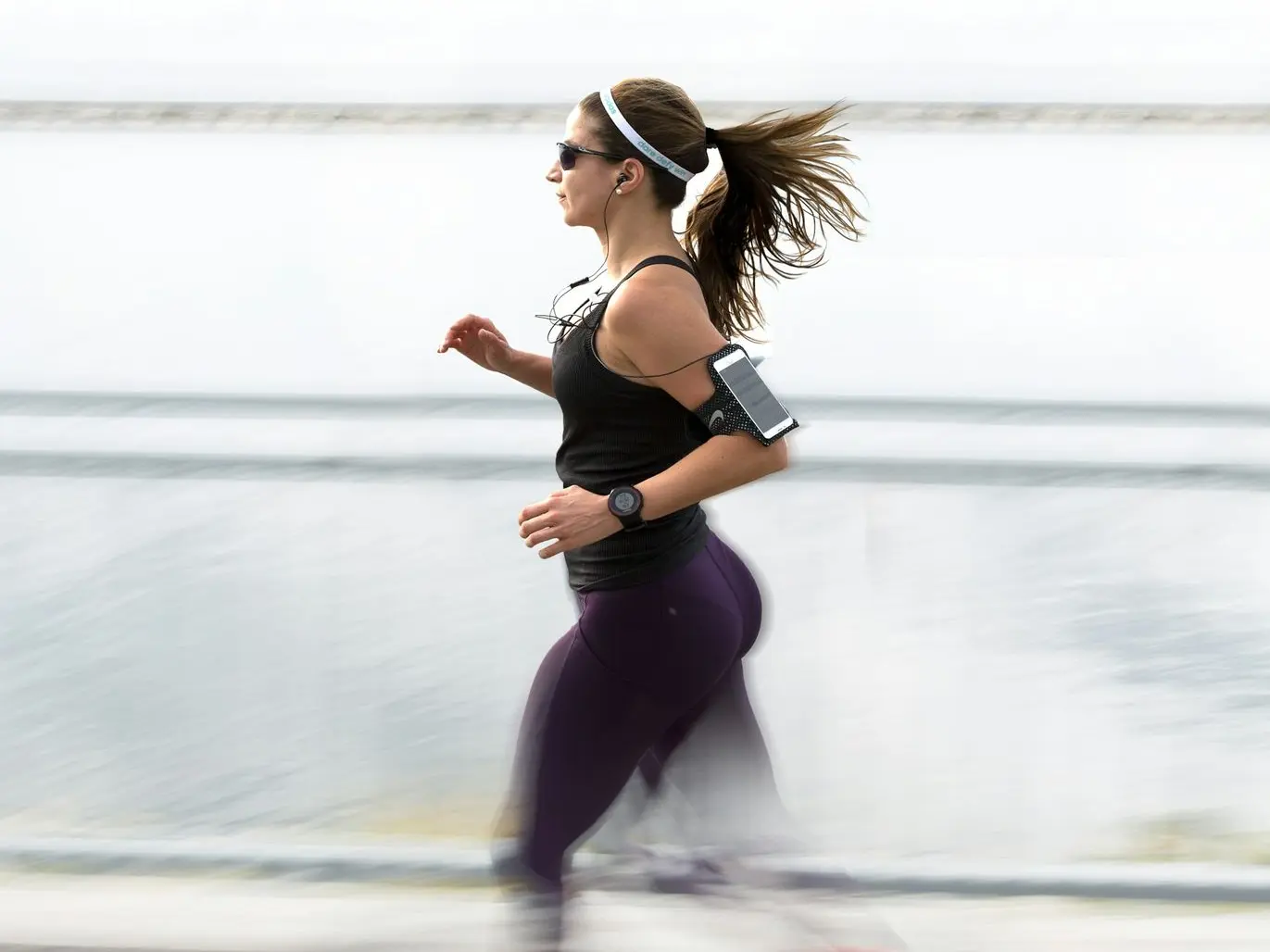 woman running wearing armband